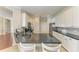 Bright kitchen with granite countertops, stainless steel appliances, and white cabinetry at 368 Snapdragon Loop, Bradenton, FL 34212