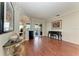 Open-concept living room featuring hardwood flooring, slider doors, and stylish decor at 368 Snapdragon Loop, Bradenton, FL 34212