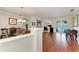 Elegant living room showcasing hardwood flooring, neutral paint, and archways leading to other rooms at 368 Snapdragon Loop, Bradenton, FL 34212