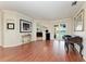 Stylish living room with hardwood floors, arched doorways, and a seamless transition to the outdoor pool area at 368 Snapdragon Loop, Bradenton, FL 34212