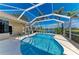 A beautiful kidney-shaped pool with a screen enclosure and view of the lake. Perfect for entertaining at 368 Snapdragon Loop, Bradenton, FL 34212