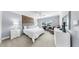 Bright bedroom with carpet, a bed with a headboard, a wood accent wall, and a ceiling fan at 3708 Wayfarer Way, Palmetto, FL 34221