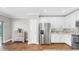 Well-equipped kitchen with granite countertops, stainless steel refrigerator, and ample cabinet space at 3708 Wayfarer Way, Palmetto, FL 34221