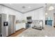 Modern kitchen featuring stainless steel appliances, granite countertops, and stylish white cabinetry at 3708 Wayfarer Way, Palmetto, FL 34221