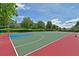 Outdoor basketball court surrounded by lush green trees at 379 Fairway Isles Ln, Bradenton, FL 34212