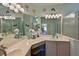 Bright bathroom with double vanity, ample lighting, and a refreshing ambiance at 379 Fairway Isles Ln, Bradenton, FL 34212