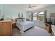 Light-filled bedroom featuring coastal decor, ceiling fan, and a peaceful ambiance at 379 Fairway Isles Ln, Bradenton, FL 34212