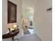 Inviting hallway with console table, decorative lamp, and tiled entryway at 379 Fairway Isles Ln, Bradenton, FL 34212