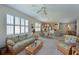 Open-concept living room and dining area with stylish furnishings and natural light at 379 Fairway Isles Ln, Bradenton, FL 34212