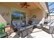 Comfortable screened-in patio with plush seating, ceiling fan, and relaxing ambiance at 379 Fairway Isles Ln, Bradenton, FL 34212