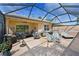 Spacious screened-in patio with comfortable seating and outdoor dining area at 379 Fairway Isles Ln, Bradenton, FL 34212
