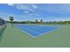 Well-maintained tennis courts on a sunny day with blue sky at 379 Fairway Isles Ln, Bradenton, FL 34212