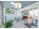 Balcony featuring outdoor furniture with views through the glass doors, providing a cozy outdoor space at 3980 Ironwood Cir # 206, Bradenton, FL 34209