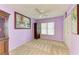 Charming bedroom with a ceiling fan, natural light, a closet, and a decorative cabinet at 3980 Ironwood Cir # 206, Bradenton, FL 34209
