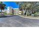 Beautiful condominium exterior with mature landscaping and ample parking, perfect for relaxed living at 3980 Ironwood Cir # 206, Bradenton, FL 34209