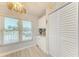 Bright dining area featuring a window with views, built-in cabinets, and plenty of storage space at 3980 Ironwood Cir # 206, Bradenton, FL 34209