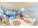 Charming dining area with a modern table, pendant lighting, and seamless flow to the living spaces at 3980 Ironwood Cir # 206, Bradenton, FL 34209