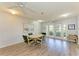 Dining room with four-chair table, ceiling fan, and sliding glass doors to the outdoors at 3980 Ironwood Cir # 206, Bradenton, FL 34209