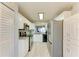 Well-lit kitchen featuring stainless steel appliances, modern backsplash, and ample cabinet space at 3980 Ironwood Cir # 206, Bradenton, FL 34209