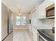 Modern kitchen with stainless steel appliances, granite countertops, and ample storage for cooking convenience at 3980 Ironwood Cir # 206, Bradenton, FL 34209
