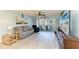 Cozy living room featuring wood-look floors, comfortable seating, and access to a private balcony at 3980 Ironwood Cir # 206, Bradenton, FL 34209