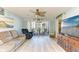 Relaxing living room with access to balcony, bright paint, and light-colored floors at 3980 Ironwood Cir # 206, Bradenton, FL 34209