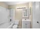 Clean bathroom with a shower-tub combination, white vanity, and updated fixtures at 4001 Crockers Lake Blvd # 16, Sarasota, FL 34238