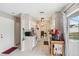 Functional kitchen with white cabinets and view of the dining room at 4062 Palau Dr, Sarasota, FL 34241