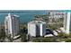 High-rise condo complex with ocean views, a pool, and covered parking at 435 S Gulfstream Ave # 1103, Sarasota, FL 34236