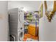 Well-organized laundry room with washer, dryer, and shelving at 435 S Gulfstream Ave # 1103, Sarasota, FL 34236