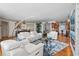 Spacious living room with white leather sofas and chairs, bright light, and elegant decor at 435 S Gulfstream Ave # 1103, Sarasota, FL 34236