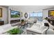 Bright living room with modern fireplace, comfortable seating and water view at 435 S Gulfstream Ave # 1103, Sarasota, FL 34236