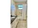 Bathroom featuring granite countertops and a shower with tile walls at 4511 Ardale St, Sarasota, FL 34232