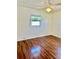 Bright bedroom with wood floors, fan, and natural light at 4511 Ardale St, Sarasota, FL 34232