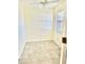 Clean bedroom featuring tiled floor and bright natural light at 4511 Ardale St, Sarasota, FL 34232