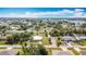 Beautiful aerial view of the property, detached garage, lush landscaping, and neighborhood setting at 521 Fairview Nw Ave, Port Charlotte, FL 33952