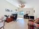 Bright home office offering ample workspace, a ceiling fan, and natural light at 5242 Highbury Cir, Sarasota, FL 34238