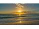 Beautiful sunset view of the ocean, with a serene beach scene at 5581 Gulf Of Mexico Dr, Longboat Key, FL 34228