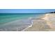 Beautiful white sand beach with crystal clear water, perfect for swimming and relaxing at 5581 Gulf Of Mexico Dr, Longboat Key, FL 34228