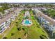 Aerial view of the community showcasing the pool, tennis courts, and green spaces at 5907 Garden Ln # H26, Bradenton, FL 34207