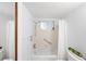 Bathroom featuring shower and window at 5907 Garden Ln # H26, Bradenton, FL 34207