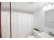 Bathroom with shower and curtain at 5907 Garden Ln # H26, Bradenton, FL 34207