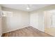 Bedroom featuring wood floors, a ceiling fan, and closet at 5907 Garden Ln # H26, Bradenton, FL 34207