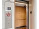 Interior of elevator with safety instructions and exit stairs information at 5907 Garden Ln # H26, Bradenton, FL 34207