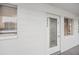 Condo unit featuring front entrance door, white walls, and windows with blinds at 5907 Garden Ln # H26, Bradenton, FL 34207