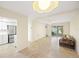 Open-concept living room with tile flooring and kitchen view at 5907 Garden Ln # H26, Bradenton, FL 34207