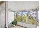 Enclosed patio showcasing a view of the lawn and community at 5907 Garden Ln # H26, Bradenton, FL 34207