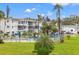 Community pool area surrounded by lush landscaping and well-maintained buildings at 5907 Garden Ln # H26, Bradenton, FL 34207