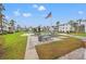 Outdoor recreation area with picnic tables, grill, and American flag at 5907 Garden Ln # H26, Bradenton, FL 34207