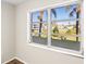 Window view overlooking the community pool and landscaping at 5907 Garden Ln # H26, Bradenton, FL 34207